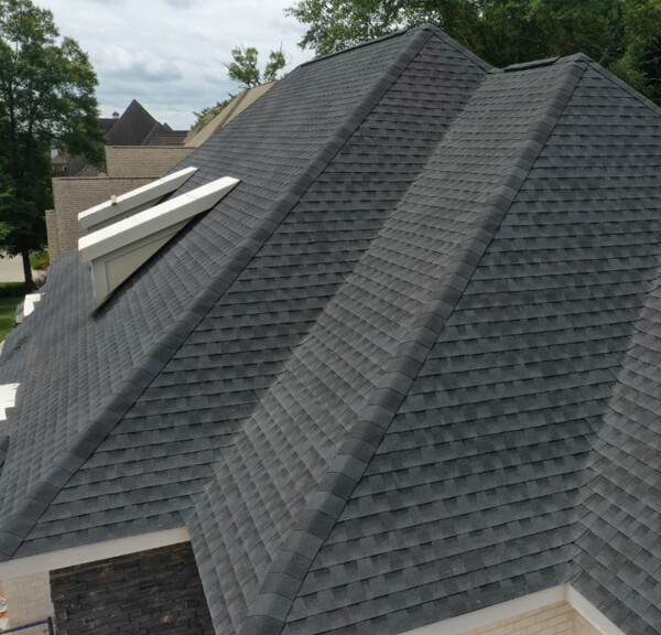 A professional roofer inspecting a leaky roof for water damage.